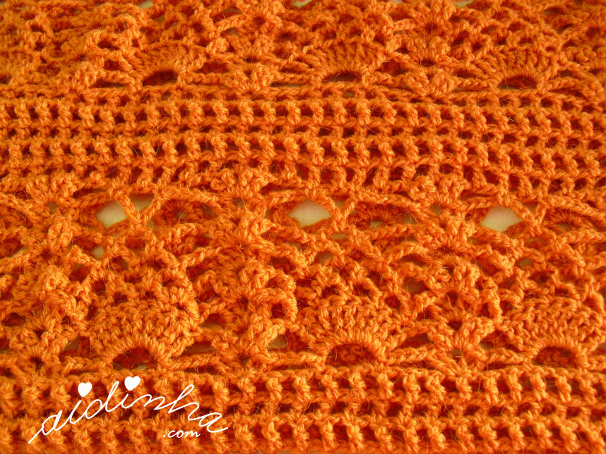Foto do ponto de crochet, utilizado na gola laranja