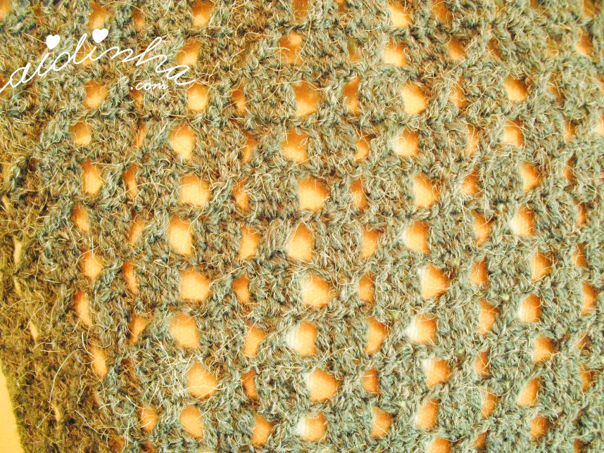 Imagem do pondo de crochet usado na gola cinza