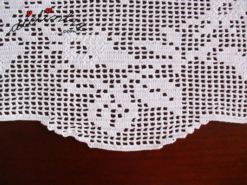 Foto de pormenor de um dos botões de rosa de crochet